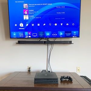 PS4 Pro with controller and 2 games